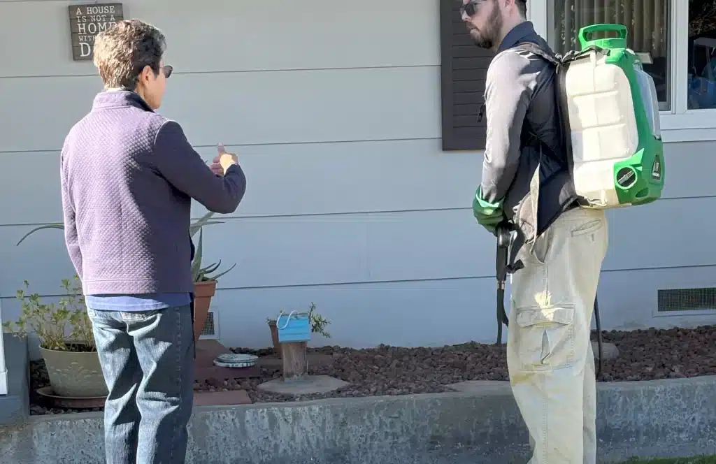 Cyrus talking to customer about a rodent problem